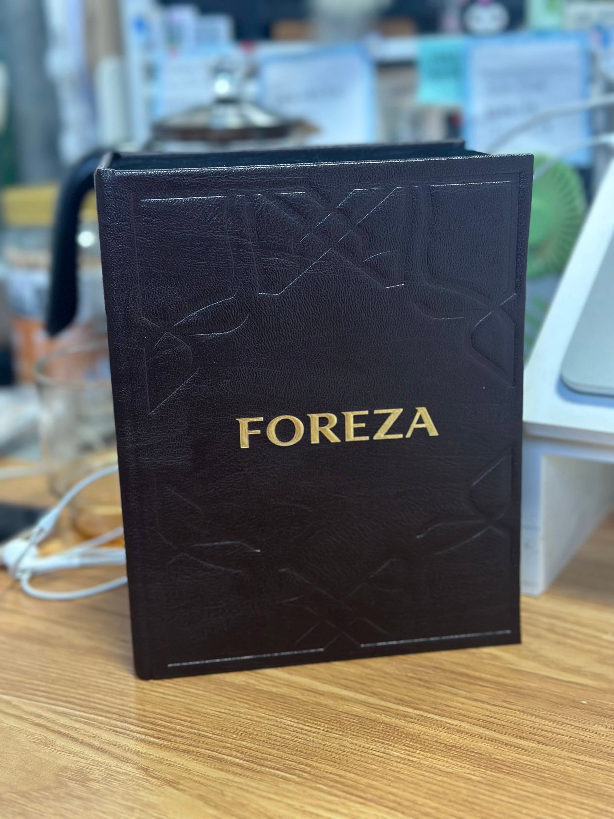 FOREZA black velvet gift box interior with silver jar and golden clip holding dark agarwood resin crumbs