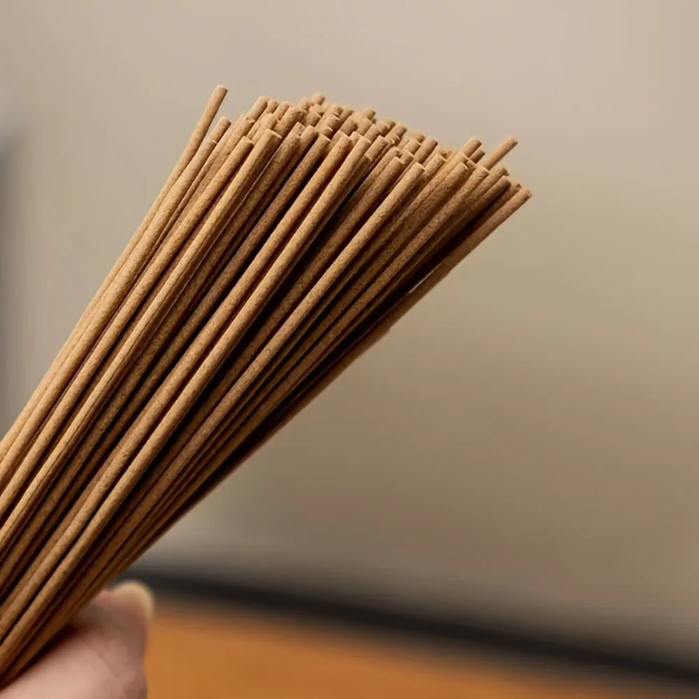 A Box of 500 Incense Sticks, 21cm Long, with the Scent of Sandalwood and Medicinal Mugwort, Suitable for Aromatherapy. They Are Placed on a Wooden Board, and the Board Is Placed on a Support Beam. Home Decor Products for Kitchens, Bedrooms, Offices, Yoga,